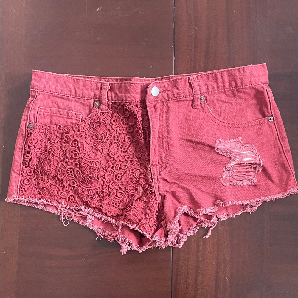 Stylish rust colored denim Women's Shorts with lace detailing.